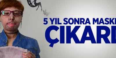 Maskeli kadın maskesini çıkardı