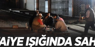 Yangına aldırmayan işçiler itfaiye ışığında sahur yaptı