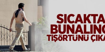 Sıcaktan bunalınca tişörtünü çıkardı