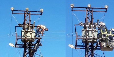 Akıma kapıldığı direkte mahsur kaldı