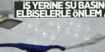 İş yerine su basınca elbiselerle önlem aldı