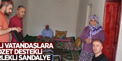 Engelli vatandaşlara klozet destekli tekerlekli sandalye