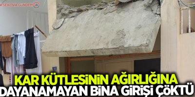Kar kütlesinin ağırlığına dayanamayan bina girişi çöktü